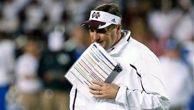 Mississippi State football coach Dan Mullen walks off the field as a time out ends in the first half of their NCAA college football game against Kentucky at Davis Wade Stadium in Starkville, Miss., Thursday, Oct. 24, 2013. (AP Photo/Rogelio V. Solis)