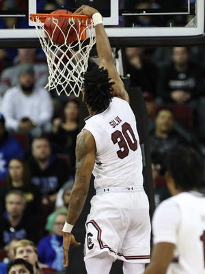 outh Carolina Gamecocks forward Chris Silva (30) gets a dunk against the Kentucky Wildcats during the first half Tuesday night at Colonial Life Arena.