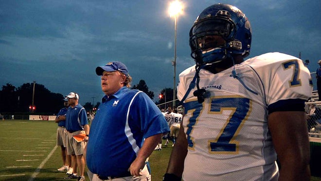 A file photo shows Coach Bill Courtney and O.C. Brown, right, in Dan Lindsay's and TJ Martin's film UNDEFEATED about the Manassas High School football team.