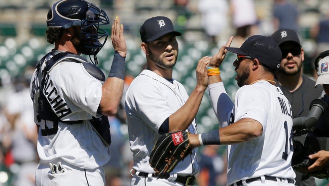 Detroit Tigers rightfielder Mike Aviles, right, greets pitcher Anibal Sanchez on June 29, 2016, in Detroit.
