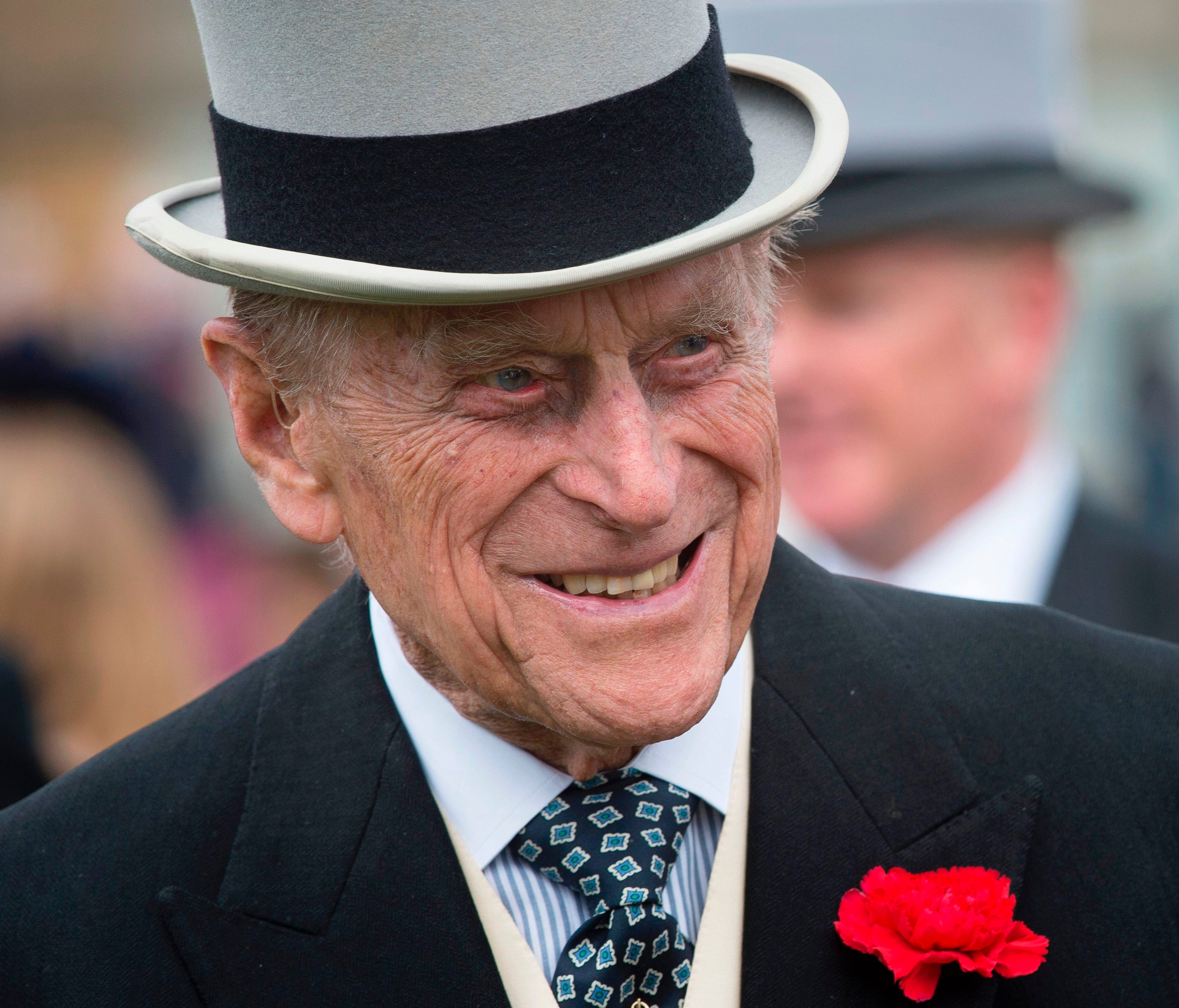 Britain's Prince Philip, Duke of Edinburgh greets guests at a garden party at Buckingham Palace in London on May 16, 2017.