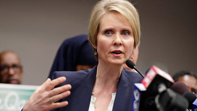 Candidate for New York governor Cynthia Nixon gestures while responding to a question during a news conference Monday, March 26, 2018, in Albany, N.Y.