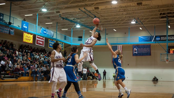 Shalette Brown goes high for the basketball.