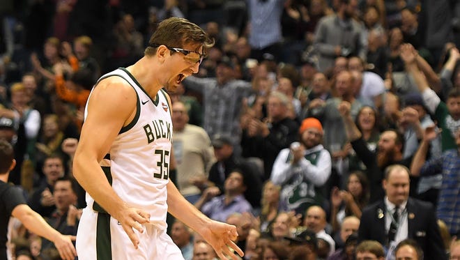 The Bucks' Mirza Teletovic and the crowd are  pumped up after he made one of his 5 three-pointers against the Hornets on Monday.