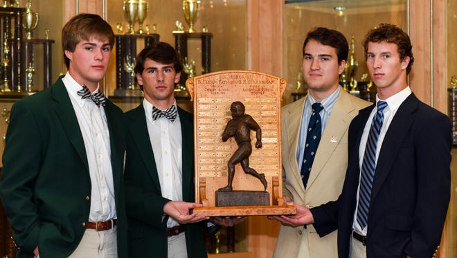 Asheville School and Christ School captains pose with the Fayssoux-Arbogast trophy earlier this week.