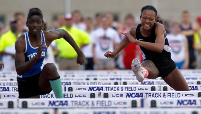 Milwaukee Riverside graduate Valerie Thames (right) competes in the 300-meter hurdles at the WIAA state meet her senior season. She won the race in a then-state record time of 43.04 seconds.