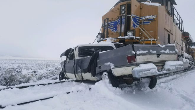 The scene of a fatal crash between a pickup truck and a train near 5600 West in Beryl, Jan. 20, 2018.