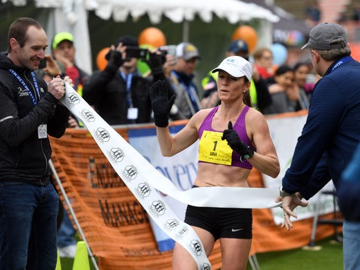 Gina Rouse crosses the finish line of the Covenant