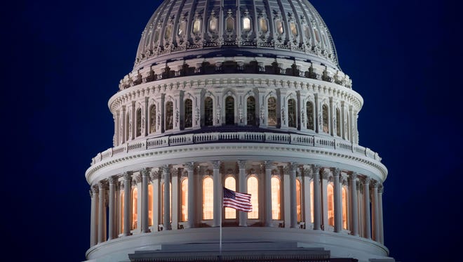 The U.S. Capitol Building is seen at dusk.