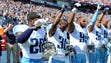Tennessee Titans players look on during the national