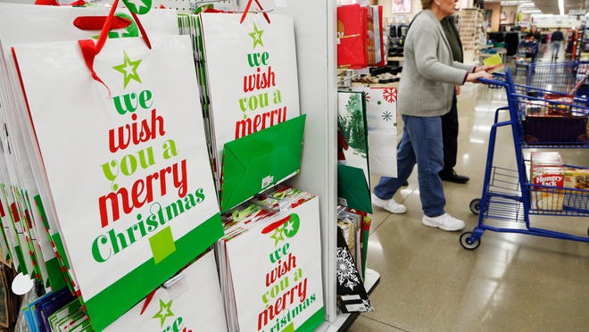 Shopper fill the aisles Tuesday, December 23, 2014, at the Meijer superstore in West Lafayette. Store Director Mike McDonald said most of the customers he sees in the store now are shopping for holiday foods, having completed their Christmas shopping earlier.