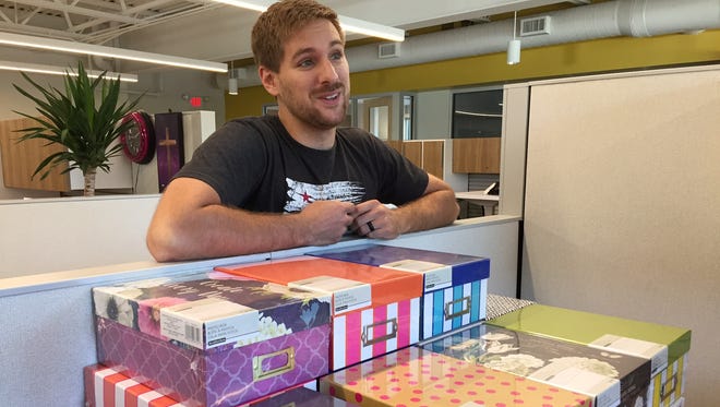 Kyle Williams, GOAL case manager at Outreach Indiana, will celebrate 33 homeless youth who are graduating from high school this year. Each grad will get one of the boxes pictured filled with cards and gifts from people in the community.