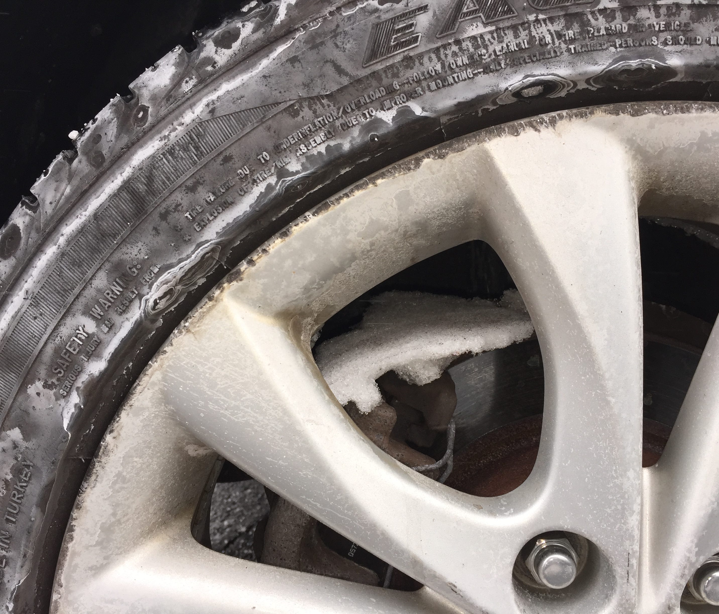 Snow buildup in the wheels of a car after Tuesday's winter storm.