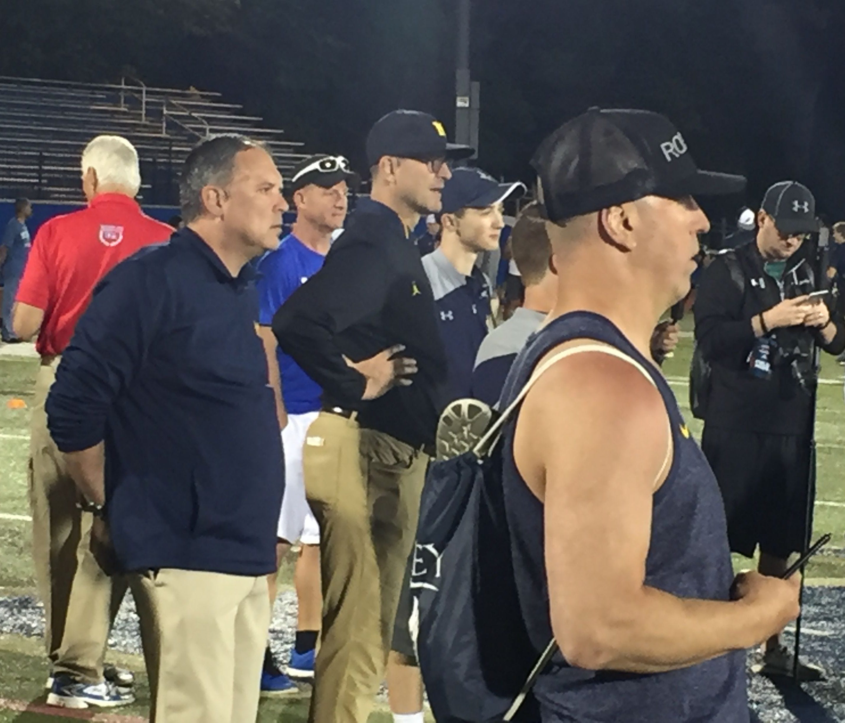Michigan coach Jim Harbaugh watches during the satellite camp Friday in University Heights, Ohio.