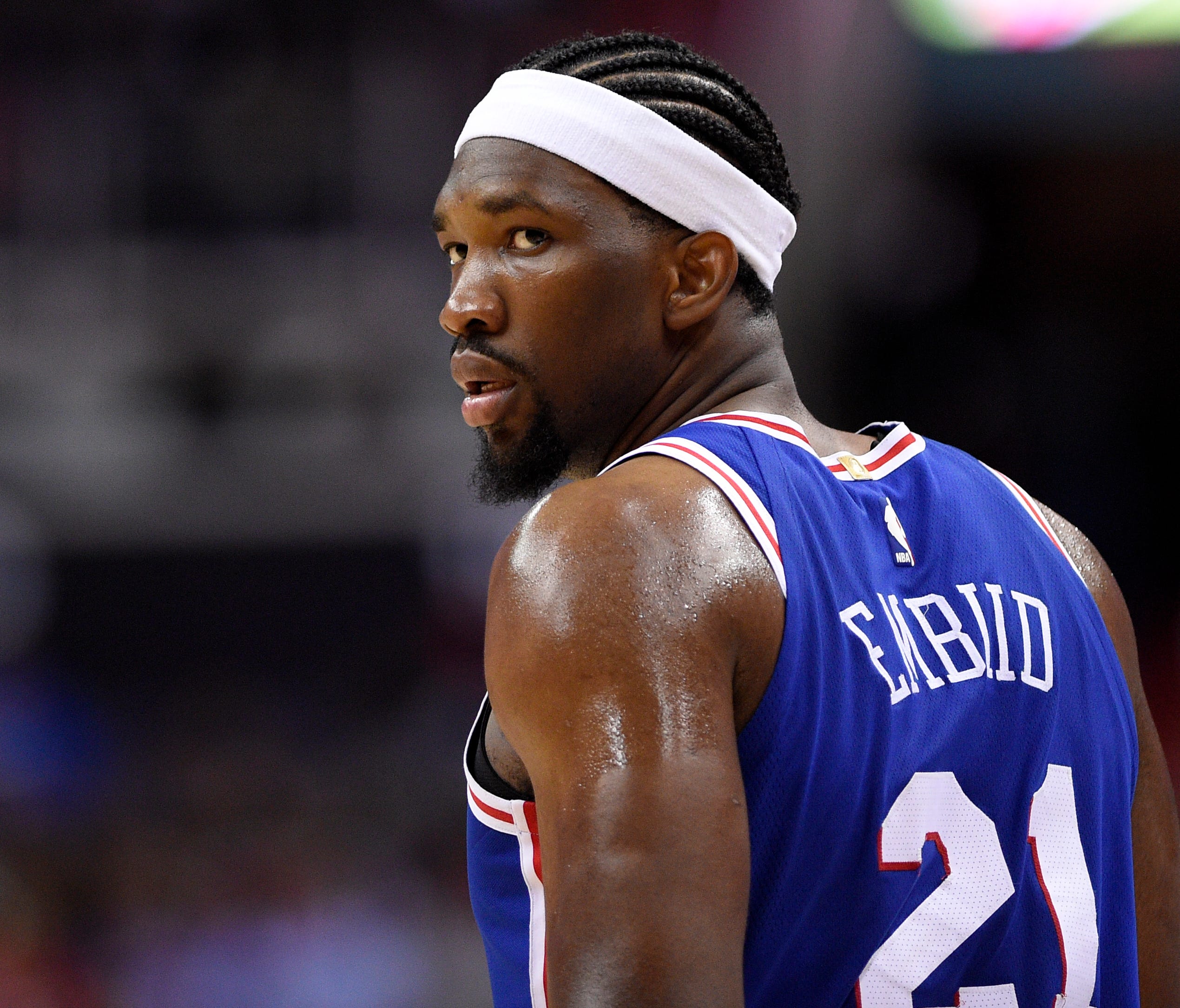 Philadelphia 76ers center Joel Embiid looks on during the second half of a NBA basketball game against the Washington Wizards.