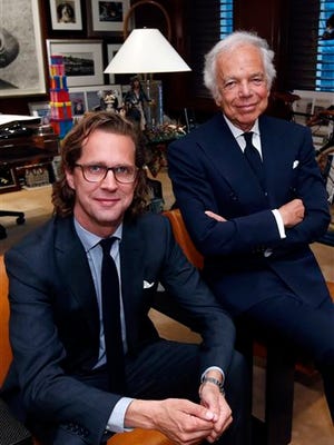 Designer Ralph Lauren, right, poses in his office with Stefan Larsson, global brand president for Old Navy, Tuesday, Sept. 29, 2015, in New York. Lauren is stepping down as CEO of the fashion and home decor empire that he founded nearly 50 years ago, and Larsson, who has been the global president of Old Navy for three years, will succeed him. (AP Photo/Jason DeCrow)