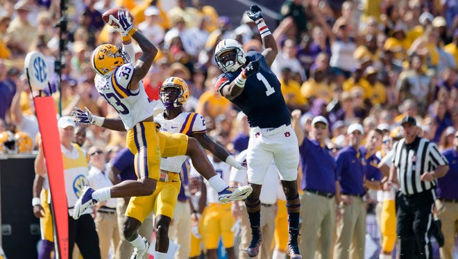 Louisiana State safety Jamal Adams (33) intercepts a pass intended for Auburn Tigers wide receiver D'haquille Williams (1) during the NCAA football game between LSU Tigers and Auburn on Saturday, Sept. 19, 2015, at Tiger Stadium in Baton Rouge, La.
