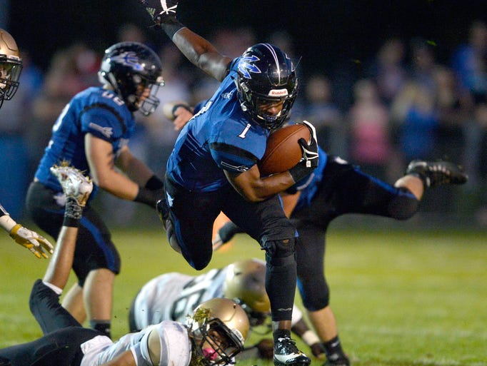 Brockport’s Cory Gross breaks a tackle during a regular