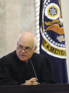 U.S. District Judge W. Keith Watkins talks briefly before swearing in George Beck as U.S. Attorney for the Middle District of Alabama at the Federal Courthouse in Montgomery on July 6, 2011. Watkins ordered former KKK leader Steven Joshua Dinkle, 30, back to prison for 10 months.