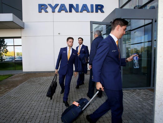 Staff leave Ryanair headquarters in Dublin on Sept.