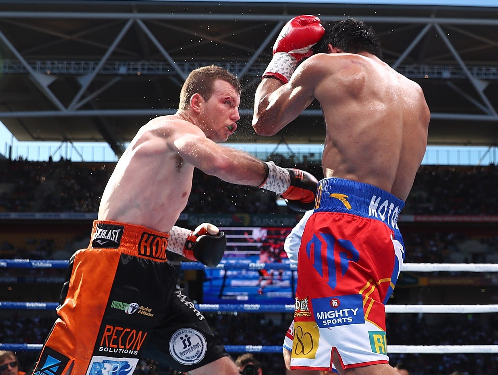 Jeff Horn and Manny Pacquiao exchange punches