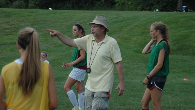 Somers girls soccer head coach Paul Saia instructs his team during a pre-season practice session at Somers High School on August 19, 2015.