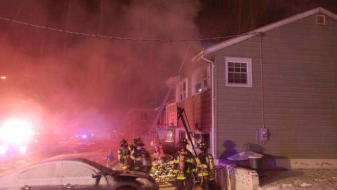 Firefighters battle a blaze in Dumont Dec. 15, 2017.