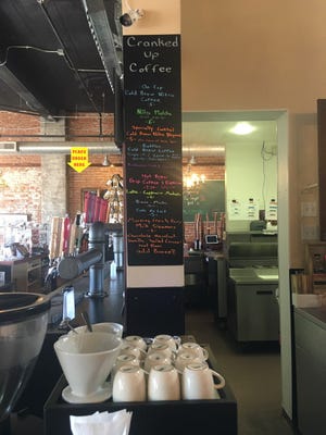 Take a look at the menu at Cranked Up Coffee, which features their signature nitro coffee on tap.