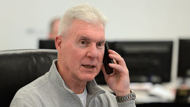 Green Bay Packers general manager Ted Thompson talks on the phone inside the war room during the NFL Draft at Lambeau Field in Green Bay on Thursday, May 8, 2014. Evan Siegle/Press-Gazette Media