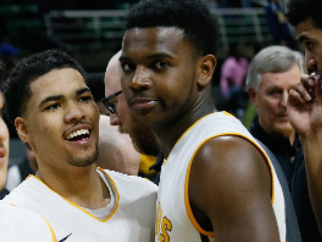North Farmington's Amauri Hardy is all smiles after defeating Lansing Everett 60-48, during the MHSAA boys basketball Class A semifinals at the Breslin Center in East Lansing, Mich. on Friday, March 25, 2016.