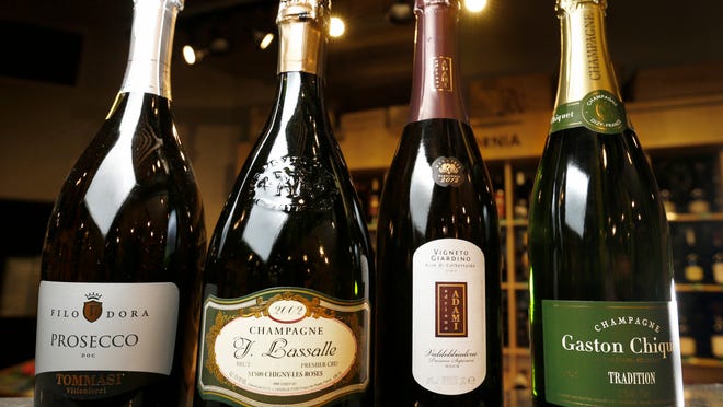 Left to right: Filo Dora Prosecco, J. Lassalle Champagne, Vigneto Giardino Prosecco and Gaston Chiquet Champagne are some of Abbe Hendricks’ choices for sparkling wine at Gateway Market in Des Moines.
