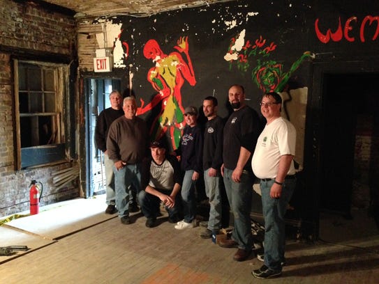 Volunteers from the Asbury Park Music Foundation remove