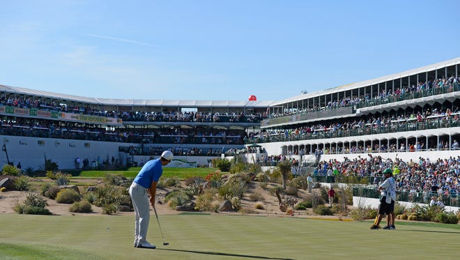Adam Hadwin putts on the 16th hole during the first round of the 2018 Waste Management Phoenix Open at TPC Scottsdale.