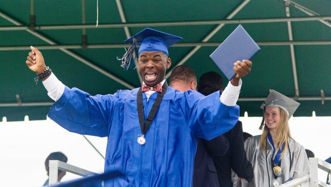 Dante Parks reacts after receiving his diploma during the Sebastian River High School class of 2018 commencement ceremony on Saturday, May 19, 2018, at Sebastian River High School in Sebastian.