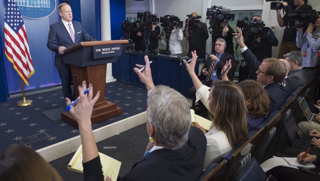 White House Press Secretary Sean Spicer holds the first daily press briefing of the Trump administration in the Brady Press Briefing Room at the White House in Washington, DC, January 23, 2017. / AFP / SAUL LOEB        (Photo credit should read SAUL LOEB/AFP/Getty Images)