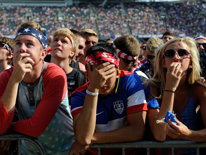 Jul 1, 2014; Chicago, IL, USA; Fans react  during a viewing party after Belgium scored a goal against the USA in the World Cup Soccer match during overtime at Soldier Field. Mandatory Credit: David Banks-USA TODAY Sports ORG XMIT: USATSI-185748 ORIG FILE ID:  20140701_ajl_bb6_084.JPG