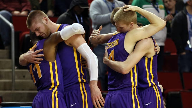 From left, UNI’s Wes Washpun, Seth Tuttle, Paul Jesperson and Nate Buss react after falling 66-53 to Louisville in the round of 32 Sunday. Despite the loss, the Panthers reached their highest AP ranking, won the Missouri Valley Conference Tournament and set a school record for wins.