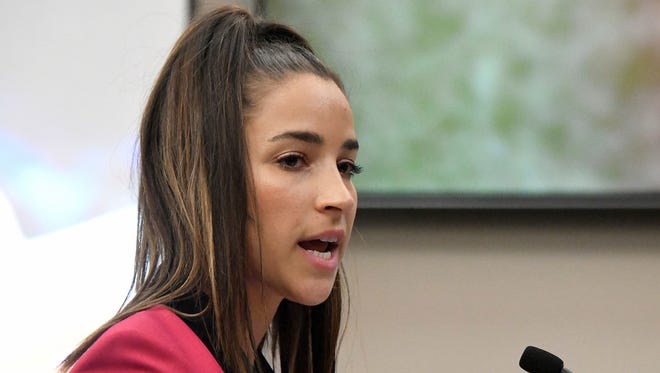 Aly Raisman is suing the U.S. Olympic Committee and USA Gymnastics in a California court.