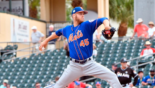 New York Mets starting pitcher Zack Wheeler (45) delivers a pitch against the Miami Marlins during a spring training game Monday at Roger Dean Stadium in Jupiter.