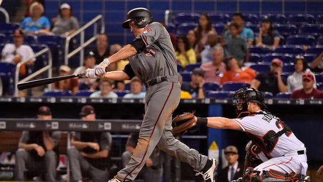 Jun 28, 2018: Arizona Diamondbacks starting pitcher Zack Greinke (21) drives in a run with a single in the sixth inning against the Miami Marlins at Marlins Park.
