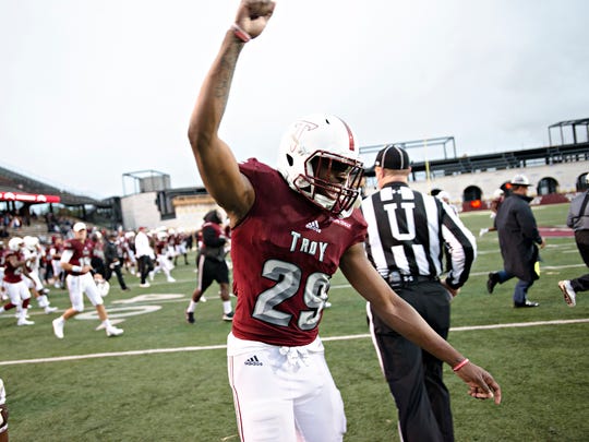 Troy linebacker Tron Folsom (29) celebrates after the