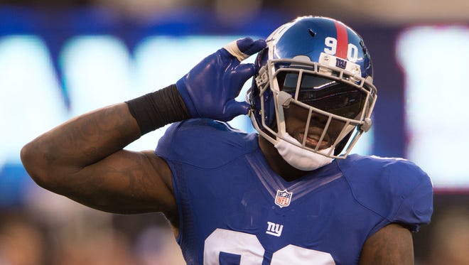 New York Giants defensive end Jason Pierre-Paul (90)  reacts during the second half against the Philadelphia Eagles at MetLife Stadium.