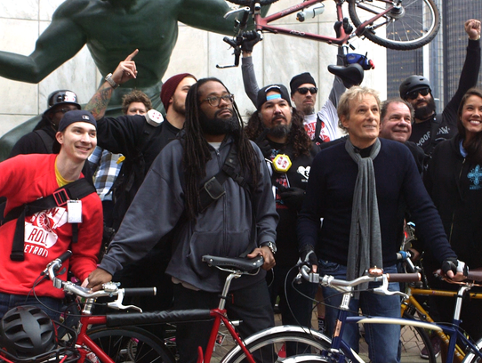 Michael Bolton with riders from Slow Roll Detroit in