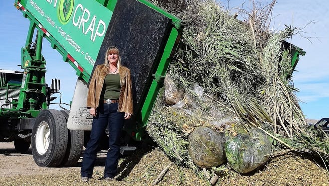 Robin Lawrence, new solid waste administrator, stands next to the Green Grappler dropping off a load of green waste to be chipped. The Old Foothills Landfill, at 555 S. Sonoma Ranch Blvd., is the place to treecycle your Christmas tree after the holiday.