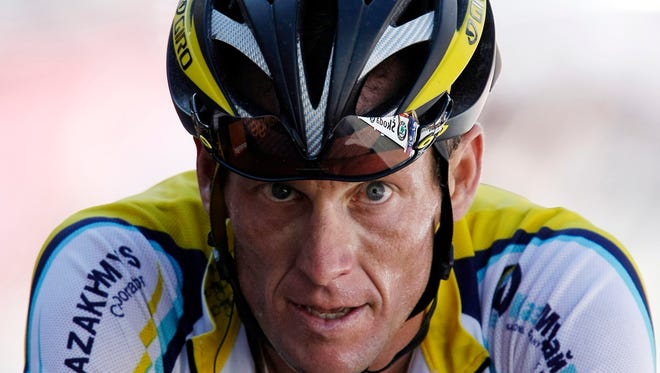 Lance Armstrong shown crossing the finish line during the 15th stage of the Tour de France in 2009.