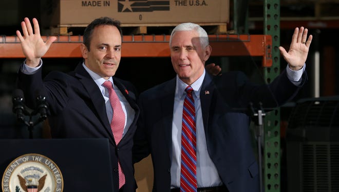 Gov. Matt Bevin, left, and Vice President Mike Pence greet supporters at the Trane Parts and Distribution Center in Louisville.Mar. 11, 2017