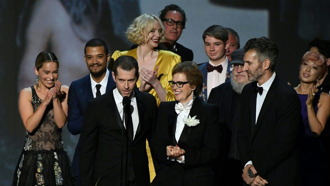 Writer-producer D.B. Weiss (C-L) and the cast of "Game of Thrones" accept the award Outstanding Drama series onstage during the 70th Emmy Awards at the Microsoft Theatre in Los Angeles on Sept. 17, 2018.