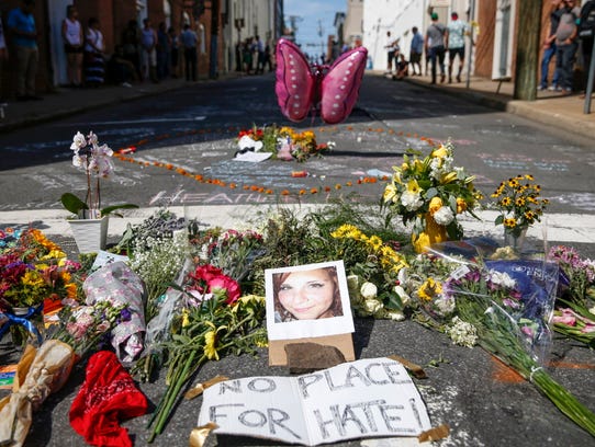 Flowers and notes are left in memory of Heather Heyer,