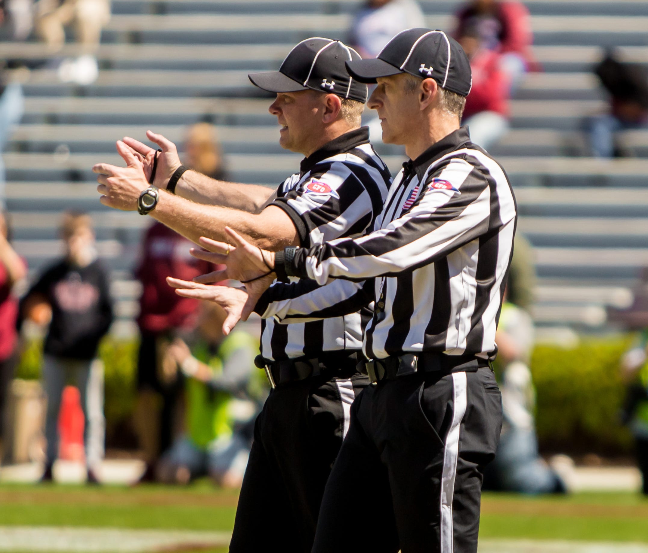 USA TODAY college football writer George Schroeder, right, shadows back judge Jimmy Russell.