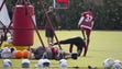 Cardinals AQ Shipley stretches on his side during OTAs